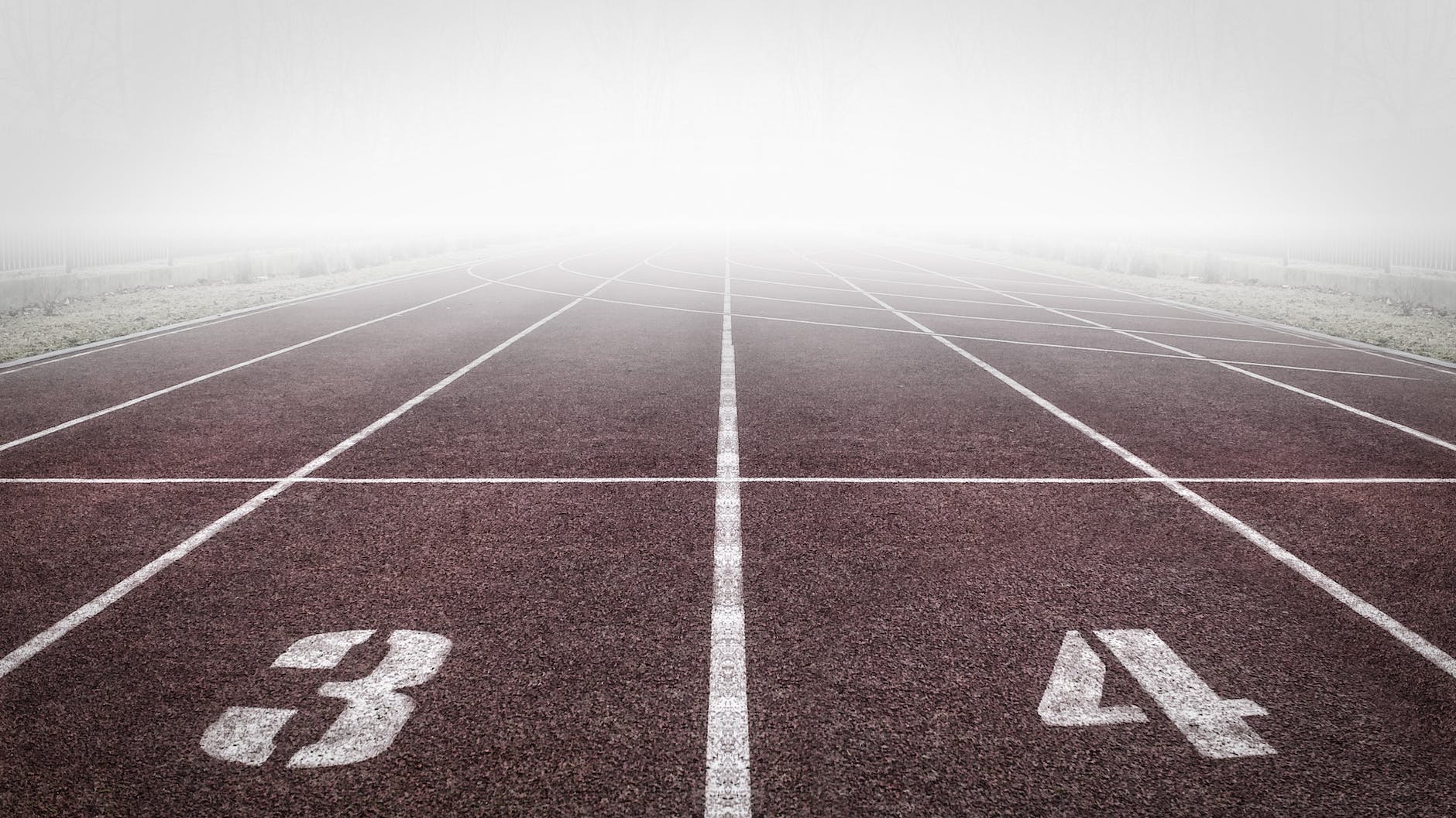 brown and white track field, related to goalsetting in an article regarding wellbeing.