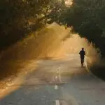 A person jogging down a road for a post referencing Quitter's Day.