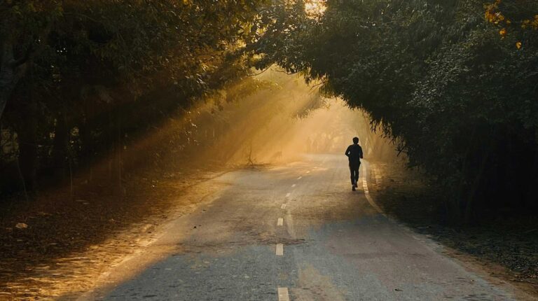A person jogging down a road for a post referencing Quitter's Day.